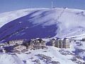 view of part of the Mt Hotham village from a helicopter flying in from Falls Creek